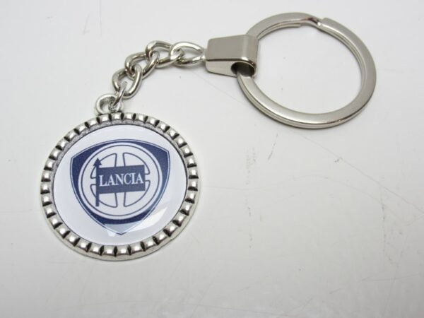 Sleutelhanger Lancia metaal ribbel rond wit -NIEUW-